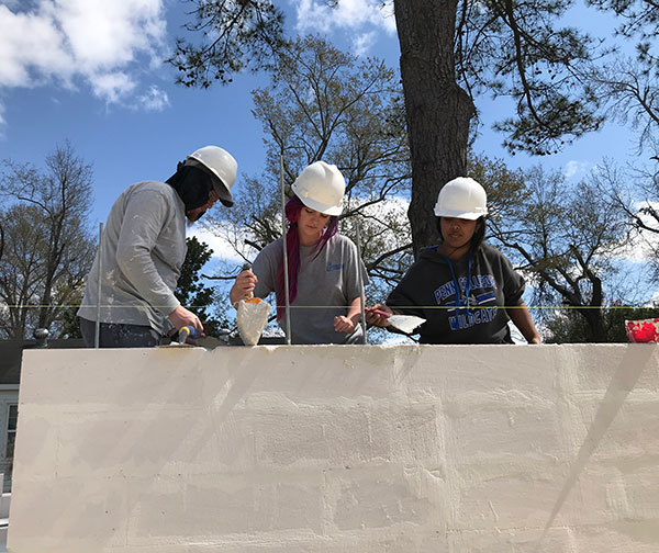 From left: Saylor, Lee and Prasad lend their helping hands.