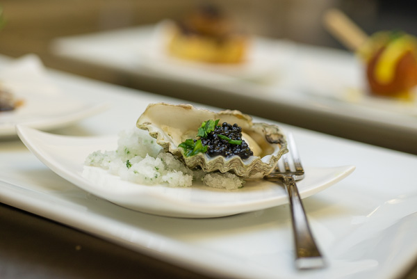 Among the reception appetizers: oysters, caviar, chive and crème fraiche