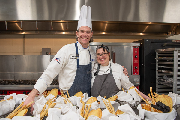 In the baking lab, Erceg strikes a pose with Chef Charles R. Niedermyer II, baking and pastry arts instructor … 