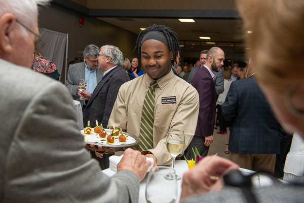 Miguel Joseph Regan, culinary arts technology, serves arancini with aioli. 