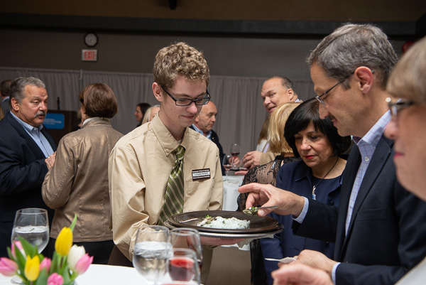 Logan M. Rider, culinary arts and systems, offers oyster and caviar appetizers. 