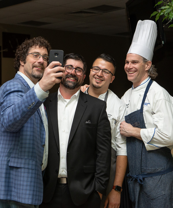 Guest Anthony Sapia (left), a baker from State College, seizes a selfie with Raffaele Colone, ‘00, forest technology, and Chefs Uribe and Niedermyer.  