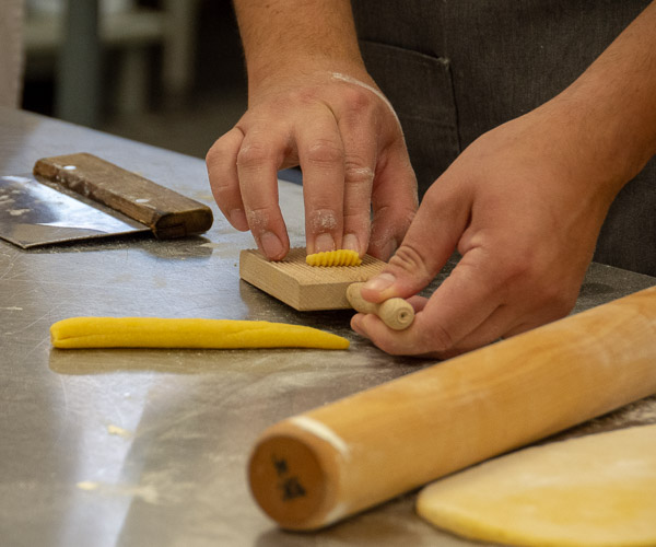 Uribe demonstrates one method and tool for shaping handmade pasta noodles.