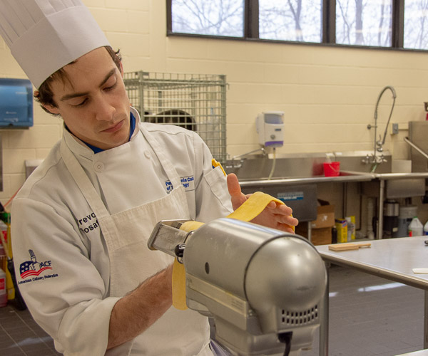 Trevor M. Rosato, of Jersey Shore, rolls pasta dough.