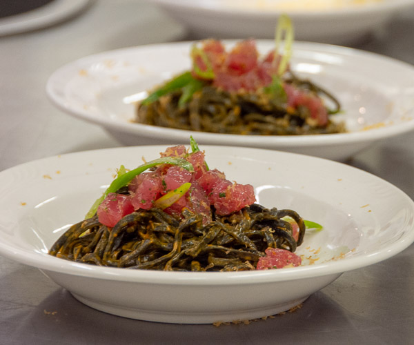 The meal’s second course is the dish that won the 2018 Barilla Pasta World Championship. It consists of housemade squid ink pasta with fresh tuna, roasted red pepper sauce, lemon, bottarga and scallions. Uribe served as sous chef to Chef Carolina Diaz, also of Terzo Piano, who was named the champion. Diaz developed the Visiting Chef menu.