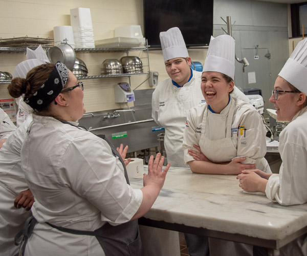 Erceg shares stories with baking and pastry arts students, including Patrick E. Hufnagel, of Antes Fort; Gloria F. Boronow, of Denver, Pa.; and Brianna M. Farmer, of McKean.