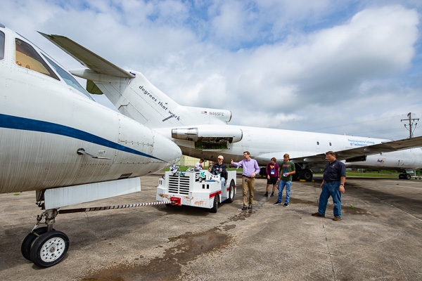 … and the towing of college aircraft guided by aviation maintenance instructors Matthew D. Krepps (at center) and Michael Damiani (at right). Degrees that work, indeed!