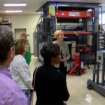 Biddle leads visitors through the Thermoforming Center of Excellence.