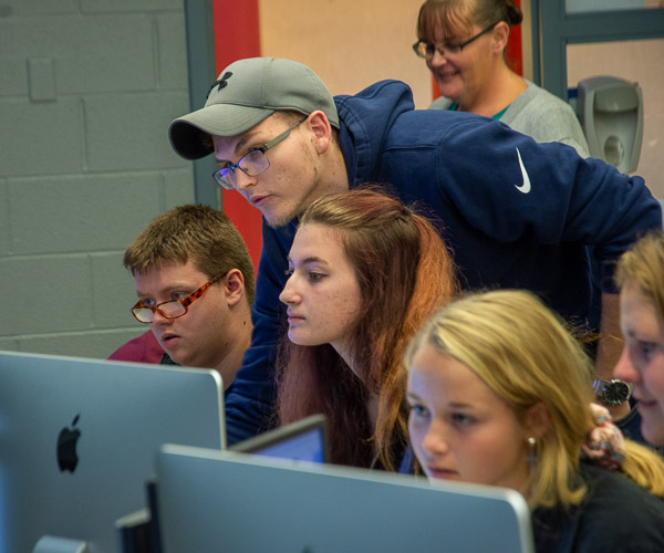 Andrew E. Young, a web and interactive media student from Hollidaysburg, provides assistance during a student-led session called “0 to Website in 45 Minutes.” (Young and Eric J. Budd, a software development and information management student from Williamsport, were under the guidance of Spyke M. Krepshaw, assistant professor of web and interactive media.)