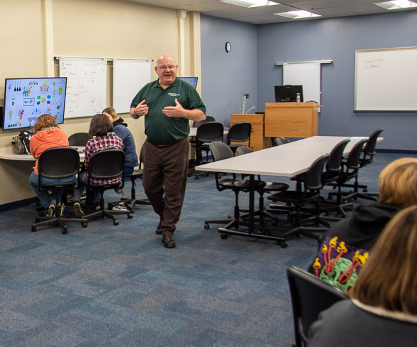 Chet Beaver, coordinator of veterans and military services, who has earned three degrees and a certificate in applied innovation leadership from Penn College, leads secondary students in creative thinking exercises to spur ideas for apps.