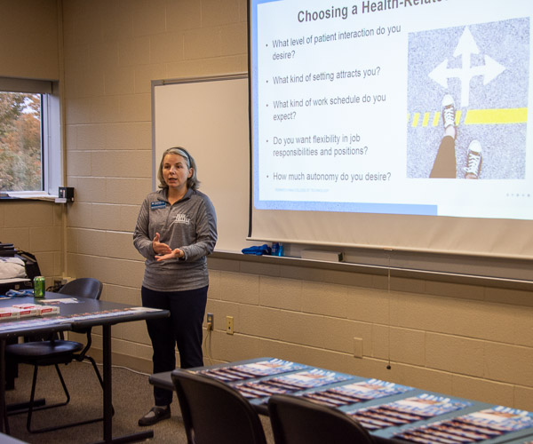 Sandra L. Richmond, dean of nursing and health sciences, talks with visitors about career options in the health care field before leading them on a tour of the school’s facilities.