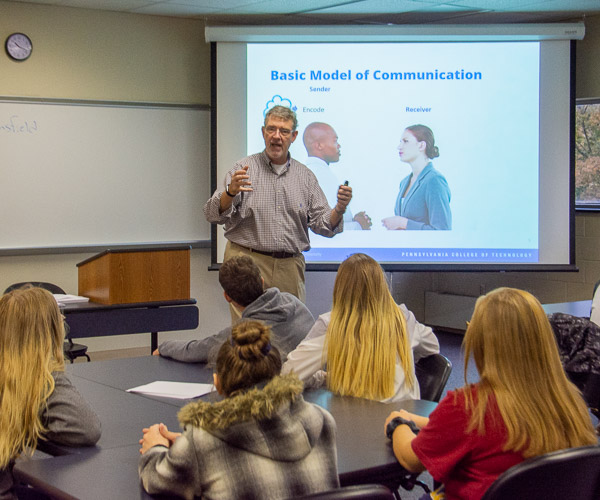 Paul L. Starkey, professor of business administration/management, leads a session on effective communication.