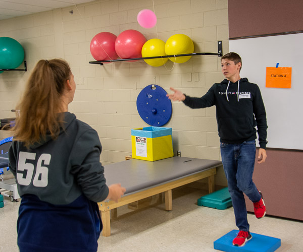 Visitors learn fun therapy techniques to test and improve balance in the physical therapist assistant lab.