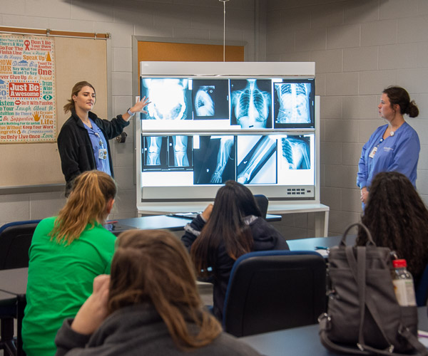 Radiography students lead visitors through a variety of activities, including a “name that bone” quiz and a look at unique, real-life images captured by Penn College students during clinical rotations.