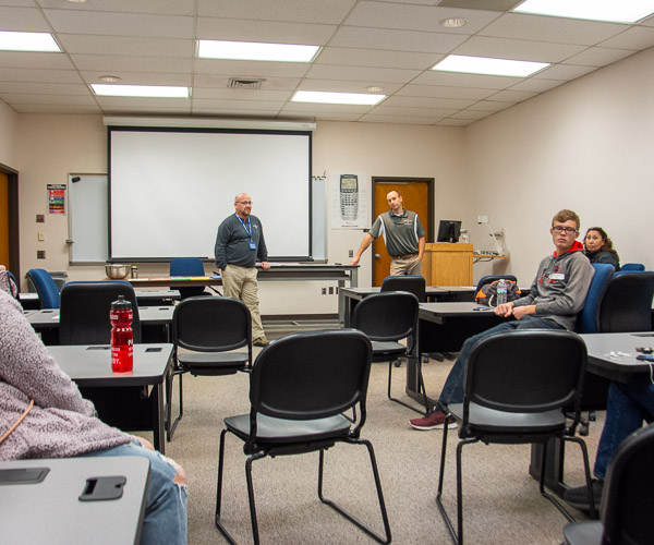 Electrical technology and operations’ Eric L. Anstadt, lecturer, and Kevin Yokitis, instructor, talk with visitors about electrical career opportunities.