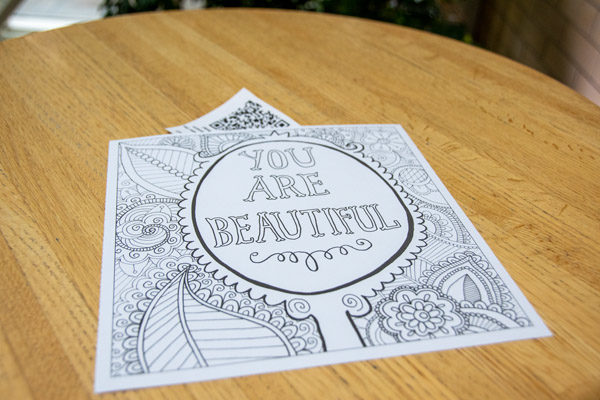 A therapeutic coloring page and QR code are placed on a table in the ATHS.