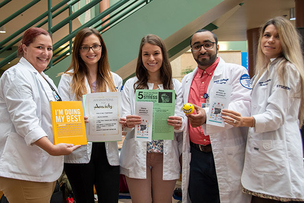 Pennsylvania College of Technology Community Health Nursing students show some of the handouts they provided as they educated their peers about anxiety in a busy campus lobby. From left: Amelia Buffington, of Montoursville; Rachal D. Clark, of Williamsport; Courtney P. Bender, of Lewistown; Mohanad Alquraish, of Safwa, Saudi Arabia; and Guzel S. Androvette, of Williamsport.