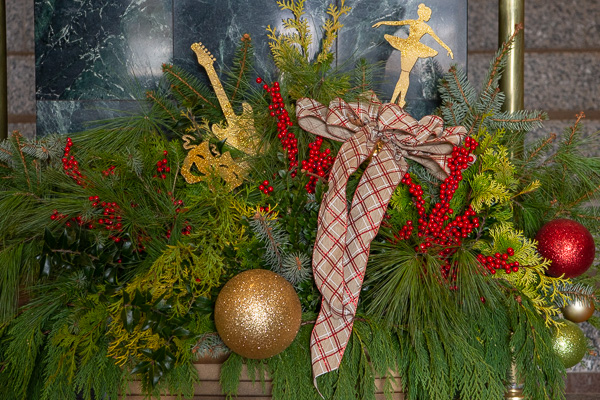 Drama, music and dance suitably adorn the Arts Center's lobby decor.