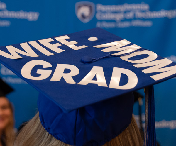 Jaid T. Smeltzer, an individual studies graduate from Avis, adds up the milestones on her cap.