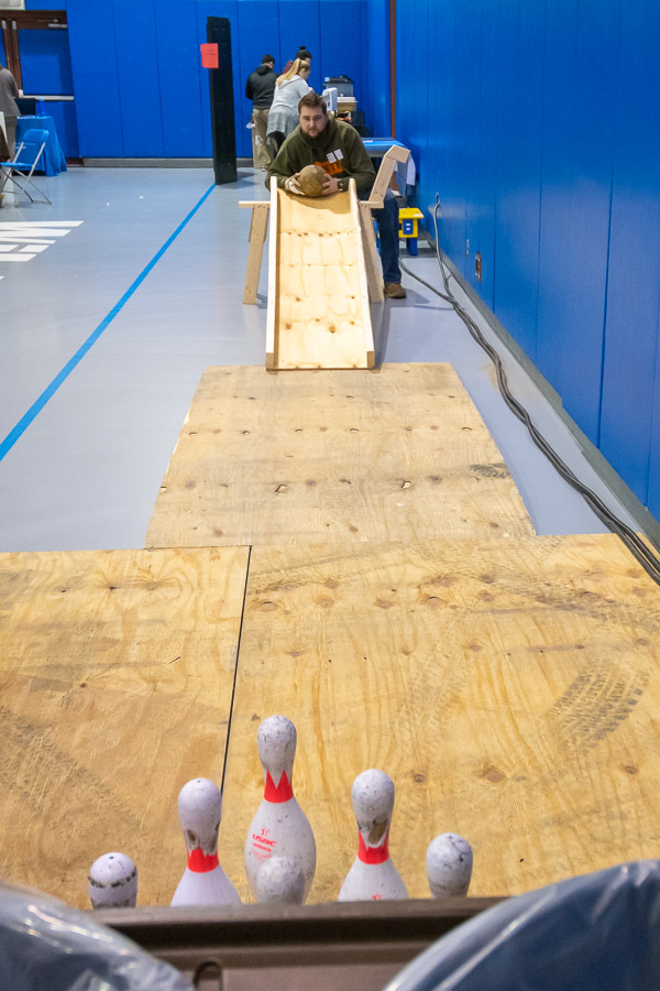 Lining up a concrete bowling ball at the ConCreate Design Club activity is Grant J. Straiton, of Williamsport, enrolled in residential construction technology and management: building construction technology concentration.