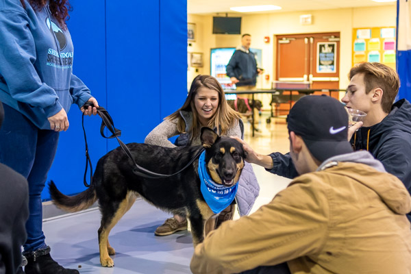 Marci M. Hessert, secretary to the School of Transportation & Natural Resources Technologies, brought her crowd-pleasing German shepherd, Odin. 