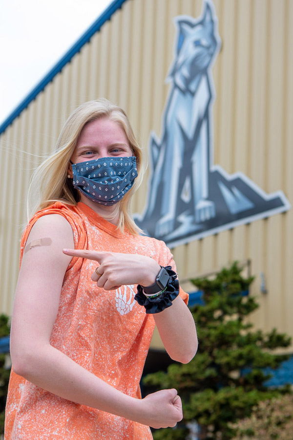 Wildcat Strong! Kelly A. Williams, a civil engineering technology student from Marion, N.Y. – and a women’s soccer player – celebrates her first “vaccine goal” outside the Field House. 