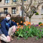 Stopping to smell the tulips in between her busy day of welcoming guests is Presidential Student Ambassador Danielle R. Wesneski, a 2019 baking and pastry arts graduate who will earn her bachelor’s degree in applied management next month.