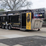 In addition to the VR experience inside, the vehicle shares officers' stories outside through interactive touch-screen technology.