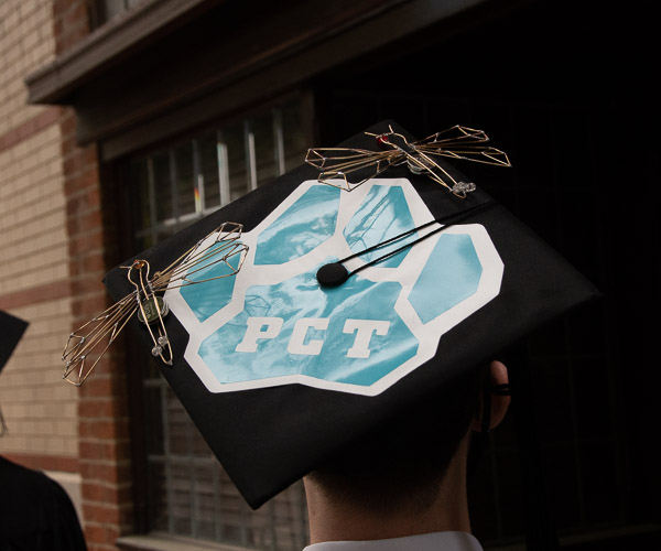 ... with a cap that includes nods to his family and his major, as dragonflies hold significance for his family, and he wired them with lights.