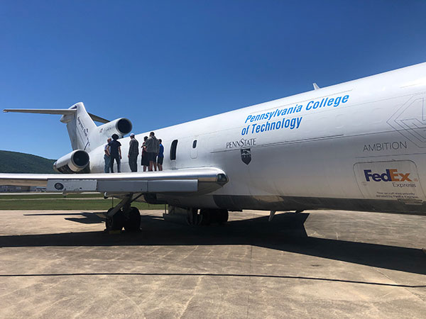 The aviation contingent prepares to step inside an attraction you don't typically see at summer camp: A Boeing 727 donated by FedEx for students' instructional use. (Photo by Matthew D. Krepps, instructor of aviation maintenance)