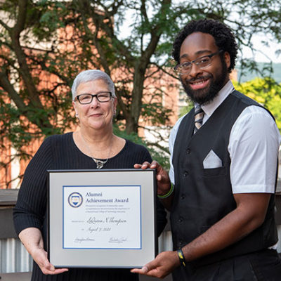 LaQuinn N. Thompson, of York, recipient of Pennsylvania College of Technology’s Alumni Achievement Award, displays the honor with President Davie Jane Gilmour.