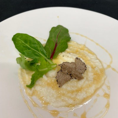 Students’ dishes include a whipped ricotta cheese appetizer garnished with black truffle honey and fresh black truffle shavings.