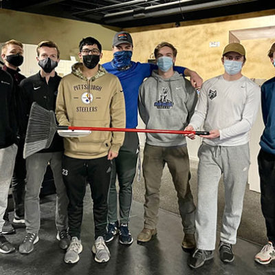 Don't let the broom fool you: Members of the Penn College men's soccer squad – NOT the curling team! – turned out in typical volunteer numbers.
