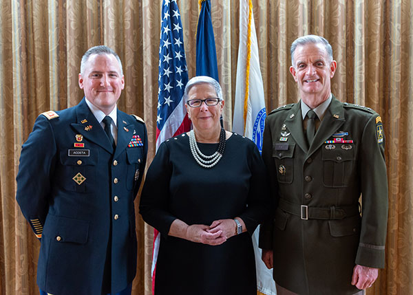 An appreciative Gilmour is flanked by Lt. Col. John C. “Chris” Acosta, ROTC instructor, and Lt. Gen. Walter E. Piatt, the 57th director of the Army Staff and the day's keynote speaker.