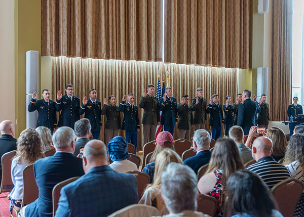 Members of the Bald Eagle Battalion raise their right hands in taking the oath of office. 