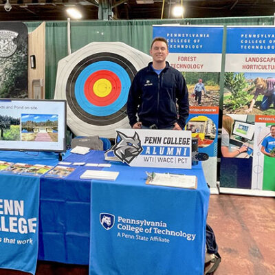 Admissions counselor Joey A Worth Jr. stands ready to greet visitors to Booth #4620 in the Pennsylvania Farm Show Complex.