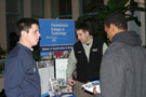 John M. Kriner, left, and Kyle S. Baker explain Penn College's construction management major to an interested high school student