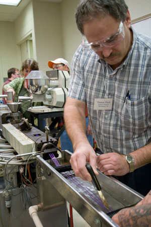 Thomas Stuck, of Double H Plastics in Warminster, participates in a twin-screw compounding workshop in a plastics and polymer technology laboratory at Pennsylvania College of Technology.