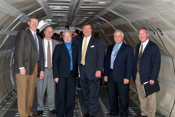 Penn College officials greet David Sutton of FedEx inside the cargo hold of the donated Boeing 727 transport aircraft. From left%3A Paul L. Starkey, vice president for academic affairs%2Fprovost%3B Barry R. Stiger, vice president for institutional advancement%3B Davie Jane Gilmour, college president%3B David Sutton, managing director of aircraft acquisition and sales for FedEx%3B Colin W. Williamson, dean of transportation technology%3B and Brett A. Reasner, assistant dean of transportation technology.