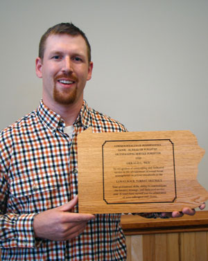 Gerald L. Hoy, a 2002 alumnus of Pennsylvania College of Technology, holds his %E2%80%9COutstanding Service Forester of the Year%E2%80%9D award from the Pennsylvania Department of Conservation and Natural Resources.