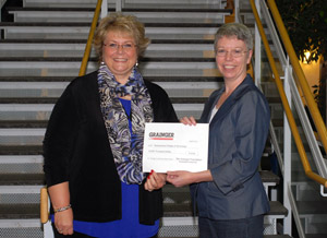 Mindy Cronk, right, branch manager of Grainger%E2%80%99s Scranton location, presents a %2410,000 scholarship donation to Debra M. Miller, director of corporate relations at Pennsylvania College of Technology.