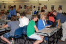 Deans and faculty/staff from the School of Business and Computer Technologies (along with representatives of other schools) form a helpful front line in the Advisement Center testing lab