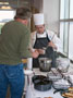 Marco G. Romano, a culinary arts and systems major from Danville, ladles a sample of mushroom bisque