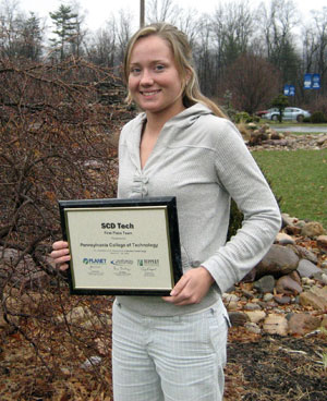 Melissa D. Berrier holds her first-place Student Career Days Tech award outside Pennsylvania College of Technology's Schneebeli Earth Science Center.