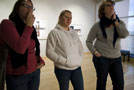 Students intently study photographer's work