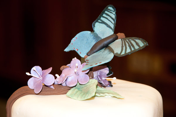 A colorfully crafted cake-topper, poised for flight