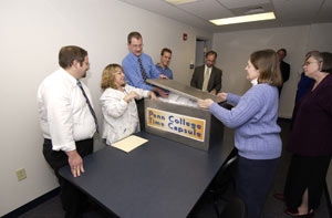 Sealing items into Penn College Time Capsule are, from left, Time Capsule Committee members James J. Folmar II, Mindy L. Carr%3B Jim W. Green, Joshua M. Appleman, Dr. Mark D. Noe and Nancy C. Bowers. Also on hand (at right) is Patricia A. Scott, collection development librarian.