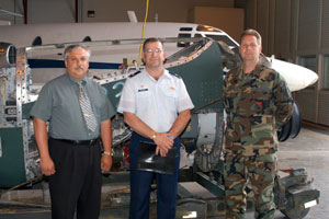 Joining in the transfer of  donated equipment from military to civilian custody are, from left, Colin W. Williamson, Penn College's dean of transportation technology%3B Lt. Col. David J. Palmer and Master Sgt. Thomas S. Lytle.