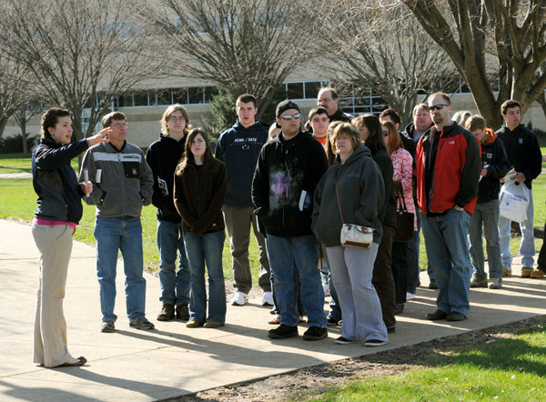 Student ambassador Hannah E. Fisher conducts a main campus tour.