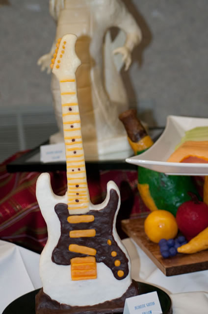 An acoustic guitar, sculpted of tallow by Joshua Morgan, received third place.